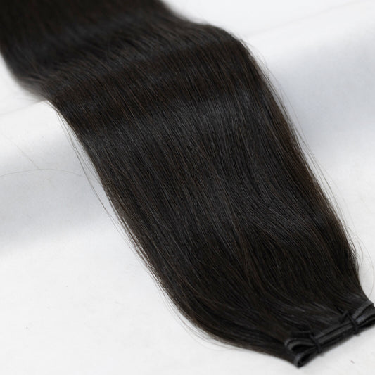 Rich, natural black hair extensions with a soft, off-black tone for a seamless blend. Available in Weft, Tape, Nano Tip, and Invisi Weft.