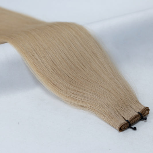 Warm golden honey blonde hair extensions for a radiant, sun-kissed look. Available in Weft, Tape, Nano Tip, and Invisi Weft.