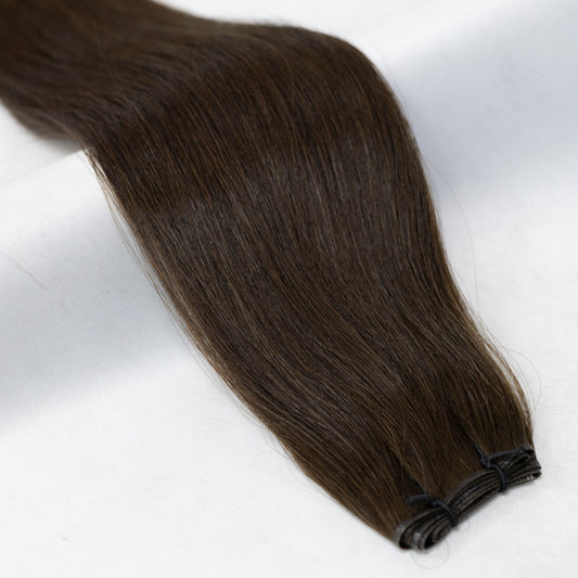 Ultra-dark brown hair extensions, nearly black in tone for a deep, rich finish. Available in Weft, Tape, Nano Tip, and Invisi Weft.