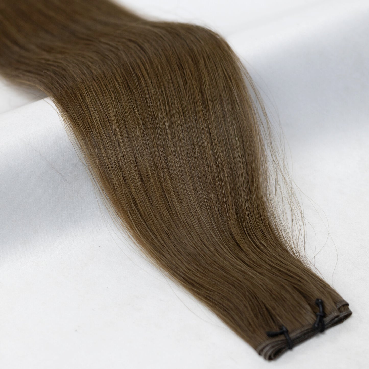 Rich, dark brown hair extensions for a seamless, full-bodied look. Available in Weft, Tape, Nano Tip, and Invisi Weft.