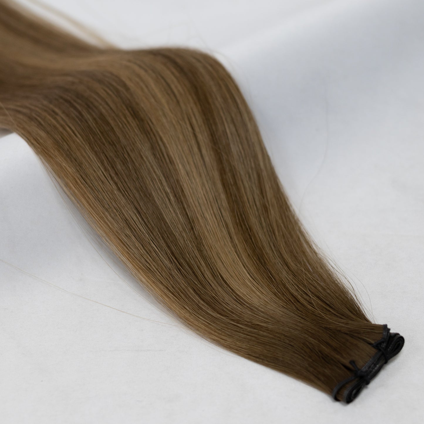 B4/6 balayage hair extensions blending deep chestnut brown with warm chocolate tones for a naturally sun-kissed look. Available in Weft, Tape, Nano Tip, and Invisi Weft.