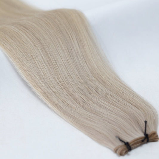 Beautifully blended ash blonde and platinum blonde hair extensions for a cool, icy blonde transformation. Available in Weft, Tape, Nano Tip, and Invisi Weft.