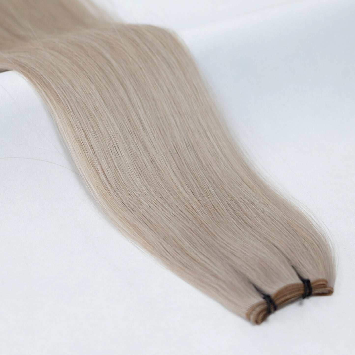 M18/60 Ash & Platinum Blonde nano tip hair extensions with ultra-fine, discreet tips for a seamless blend. A natural mix of cool ash blonde and platinum blonde for a multi-tonal finish.