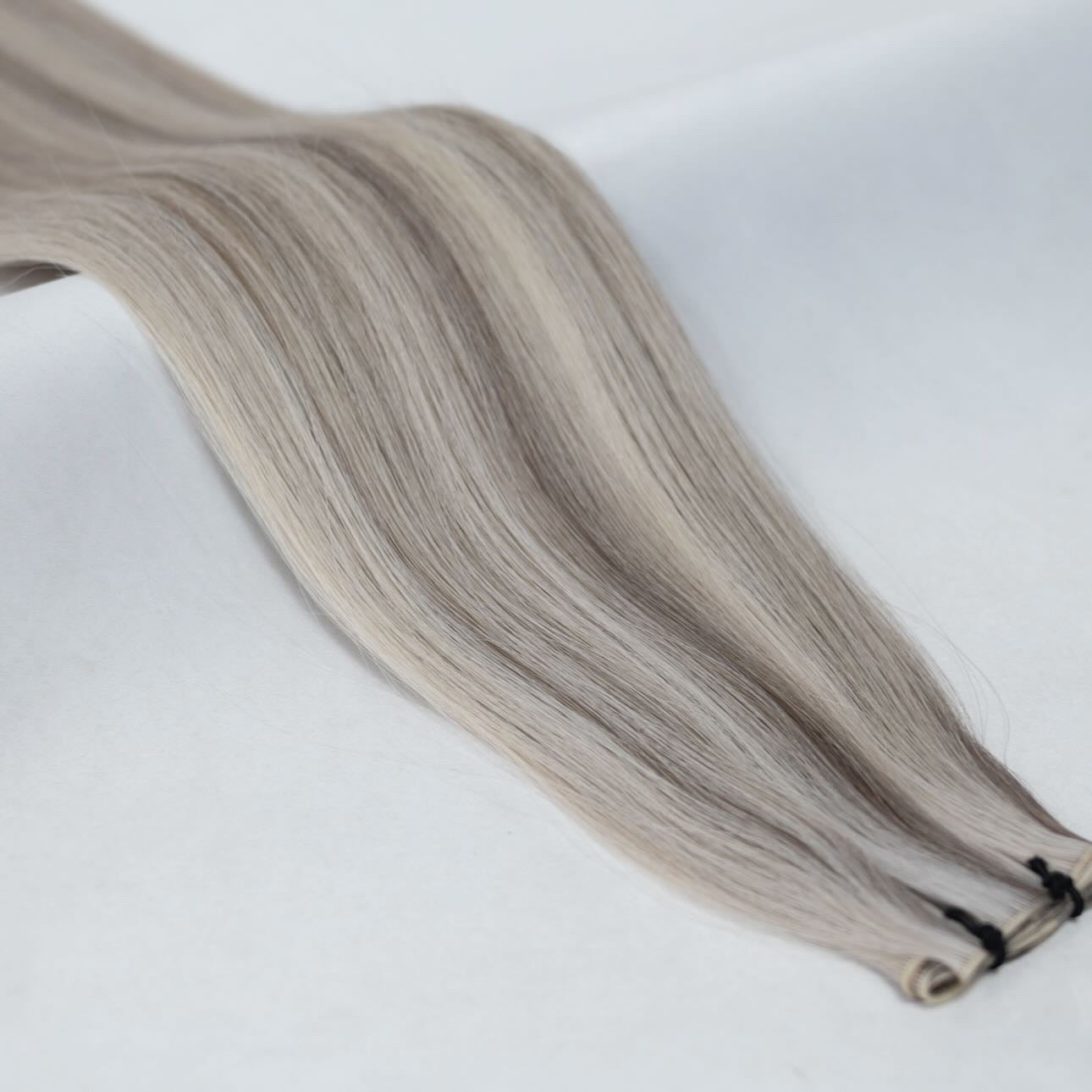 P18/60A hair extensions featuring a blend of cool ash blonde and platinum for a beautifully soft, natural finish. Available in Weft, Tape, Nano Tip, and Invisi Weft.