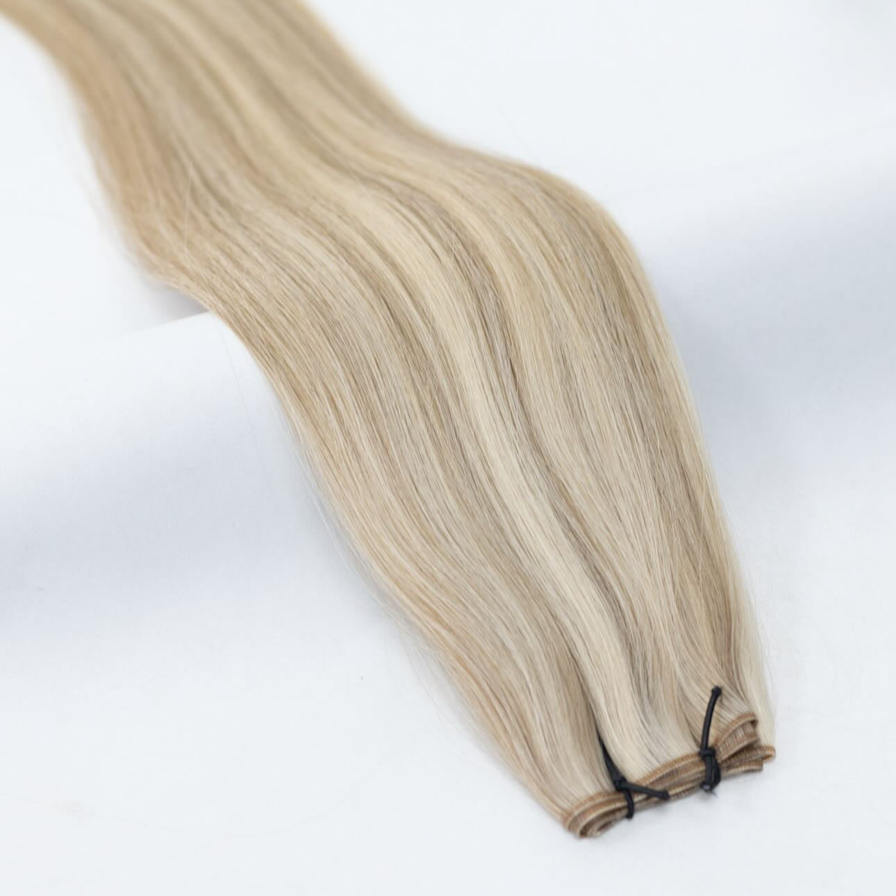 P8/60 hair extensions in a beautifully blended warm and platinum blonde shade for a natural, luminous look. Available in Weft, Tape, Nano Tip, and Invisi Weft.