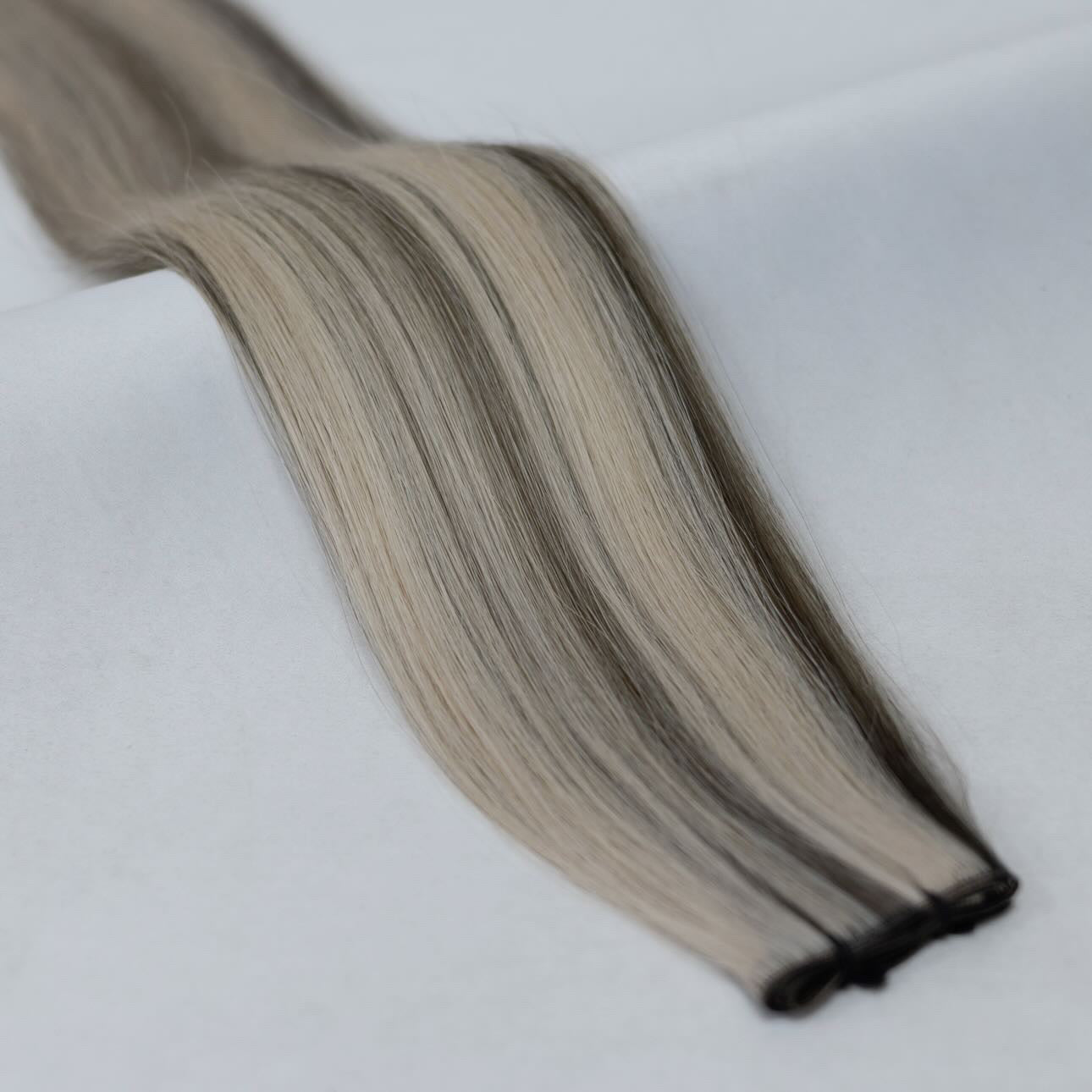 P9/60A hair extensions with a perfect balance of cool ash and bright platinum blonde for a soft, dimensional blend. Available in Weft, Tape, Nano Tip, and Invisi Weft.