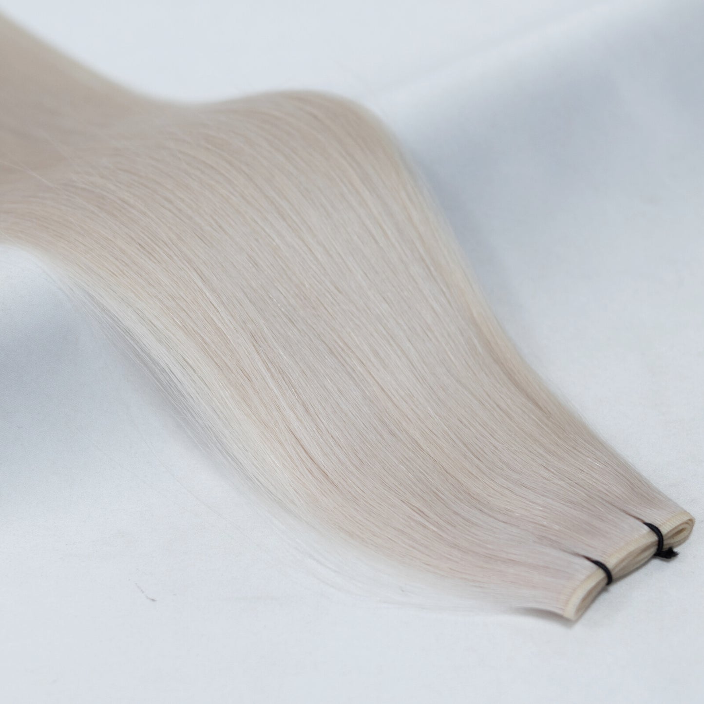 60A Ice Blonde nano tip hair extensions with ultra-fine, discreet tips for a seamless blend. A cool, icy platinum shade for a bright, flawless finish.