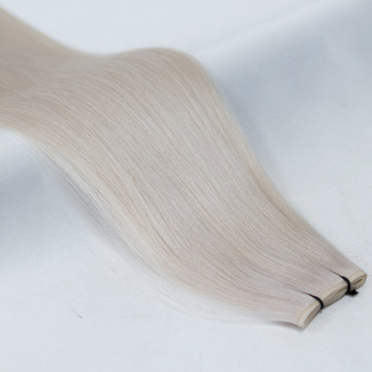 60A Ice Blonde nano tip hair extensions with ultra-fine, discreet tips for a seamless blend. A cool, icy platinum shade for a bright, flawless finish.
