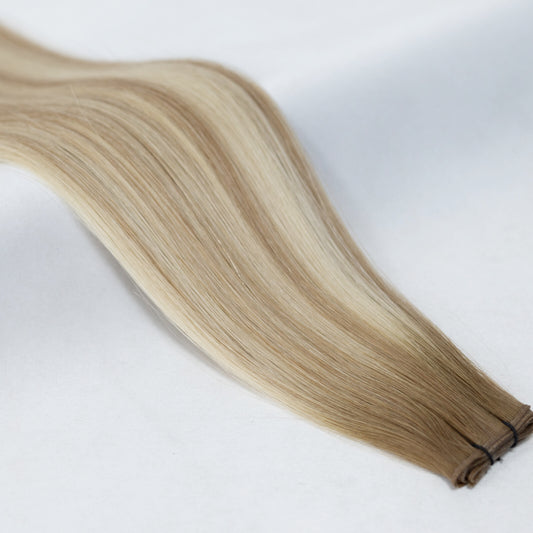 Stunning balayage hair extensions blending ash brown and platinum blonde for a natural sun-kissed look. Available in Weft, Tape, Nano Tip, and Invisi Weft.