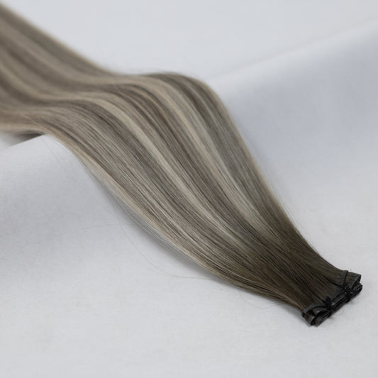 B9/60A balayage hair extensions with a smooth blend of warm blonde and platinum tones for a luminous, multi-tonal effect. Available in Weft, Tape, Nano Tip, and Invisi Weft.
