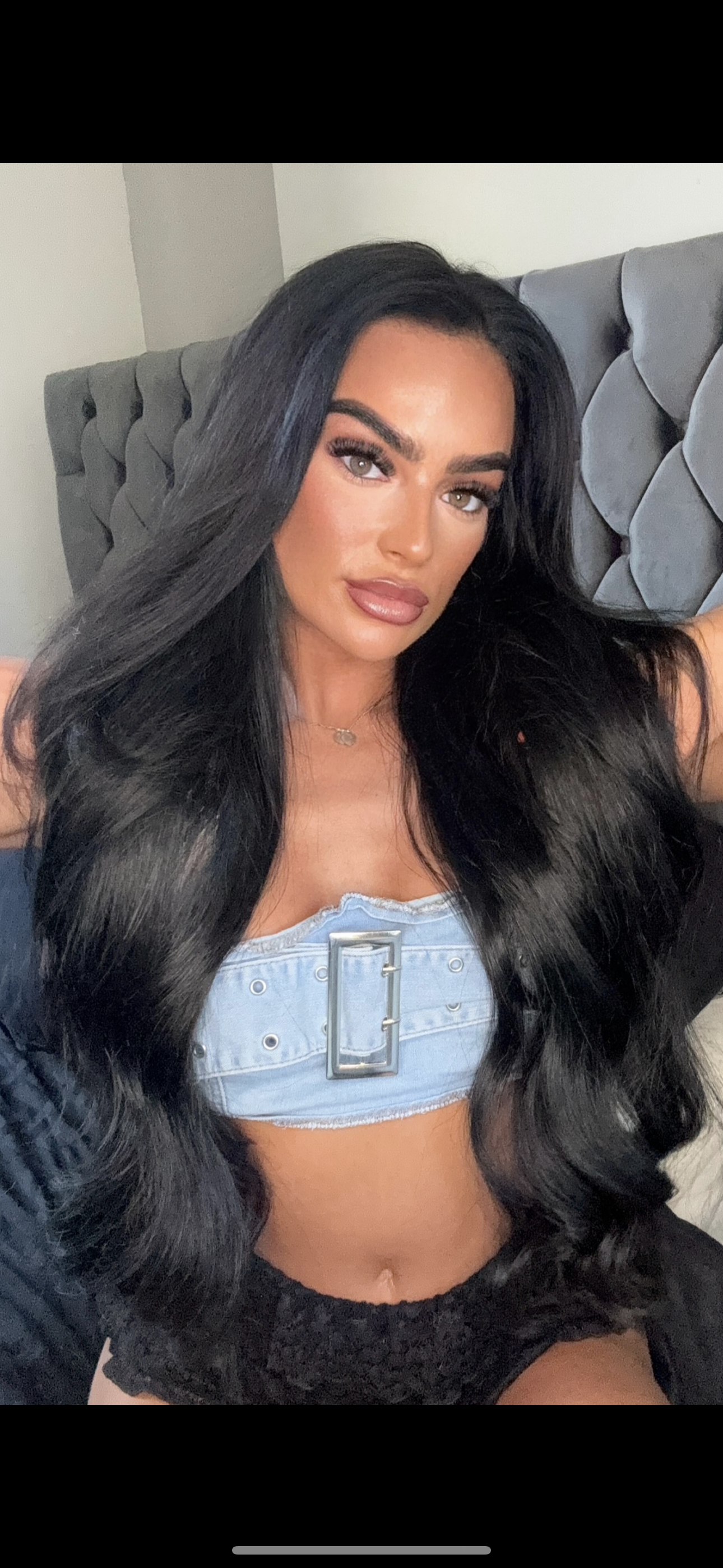 Mane Attraction founder Ebony wearing EBONY Signature Black hair extensions (#1), a deep jet black shade for a bold, seamless, and natural look.